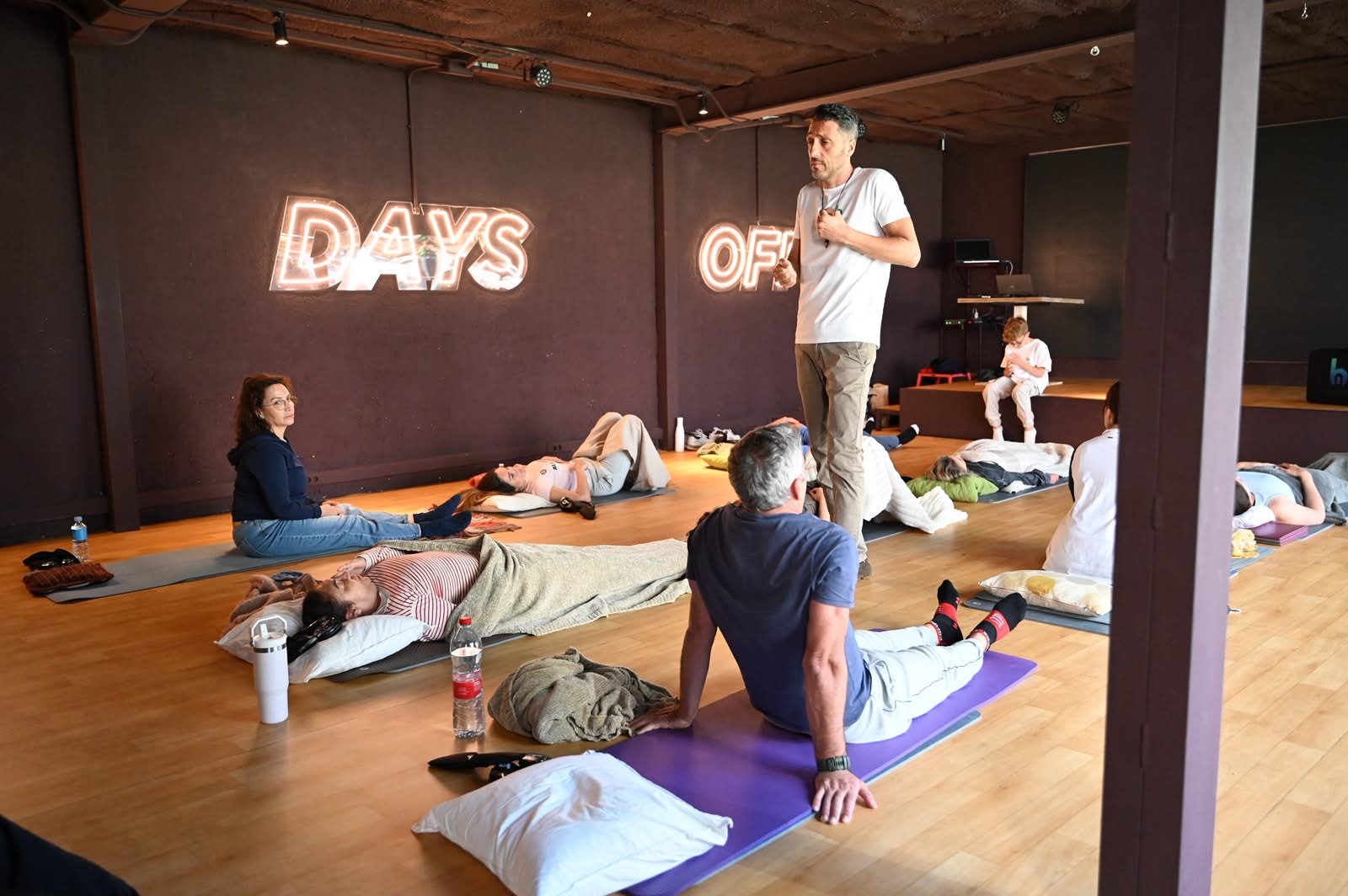 A Breathway group session with participants lying on mats
